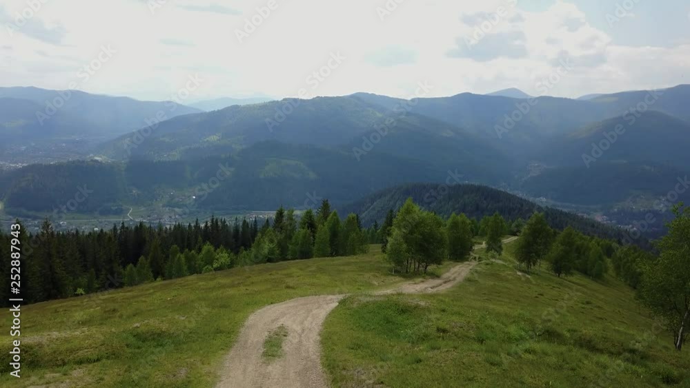Summer landscape in mountains and the dark blue sky with clouds. Aerial with drone Summer landscape in mountains and the dark blue sky with clouds. Aerial with drone
