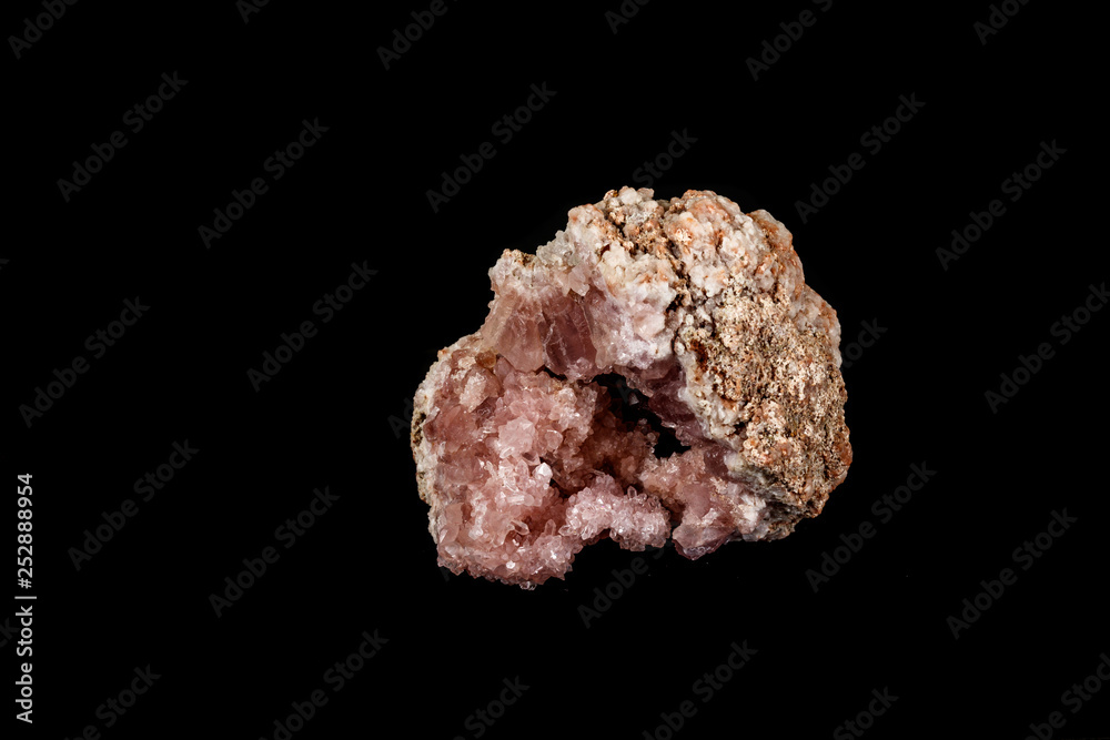 Macro mineral stone Pink Amethyst on a black background