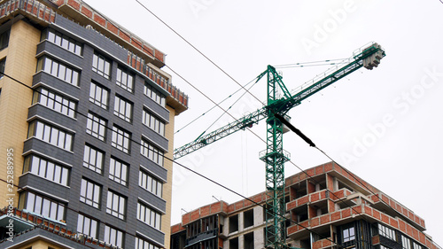 Commercial construction of a modern residential complex. Construction site background.