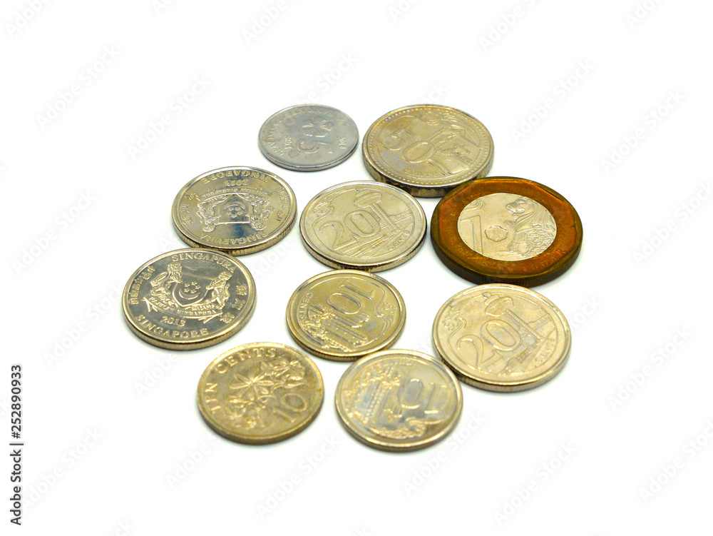 Close up pile of Singapore Dollars coins isolated on white background Close up pile of Singapore Dollars coins isolated on white background