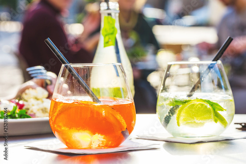 Aperol spritz and HUGO cocktail in misted glass, selective focus .