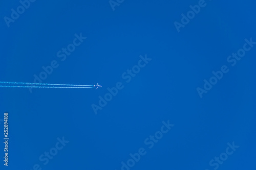 Simple winter blue sky with clouds and without, flying through the air. Natural primitive background, enlarged.
