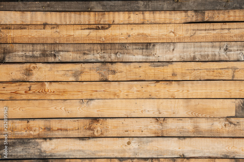 Texture of the pine boards. Horizontal wooden fence.