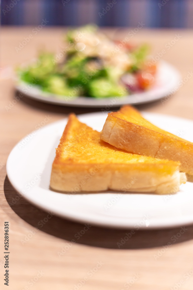 Yellow garlic bread on the table Yellow garlic bread on the table
