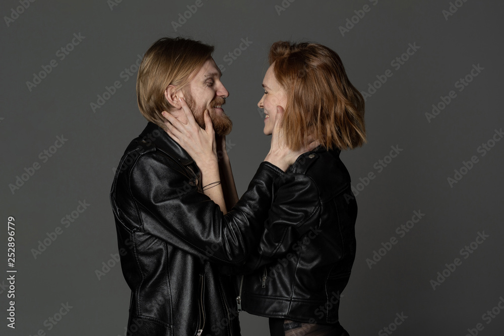 Young couple in love hug each other, looking at each other Young couple in love hug each other, looking at each other