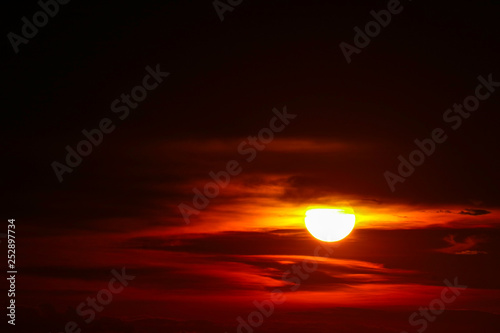 sunset on ocean last light red and orange sky silhouette cloud