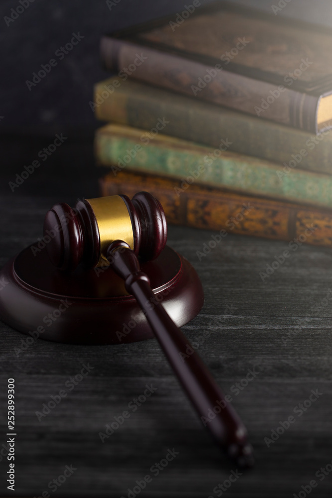 Judges Gavel on a Desk with Books in the Background