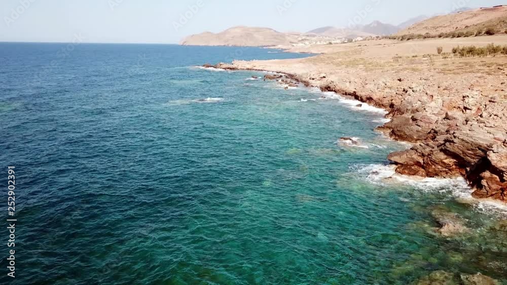 Aerial view flying along a rocky goast, greece, crete