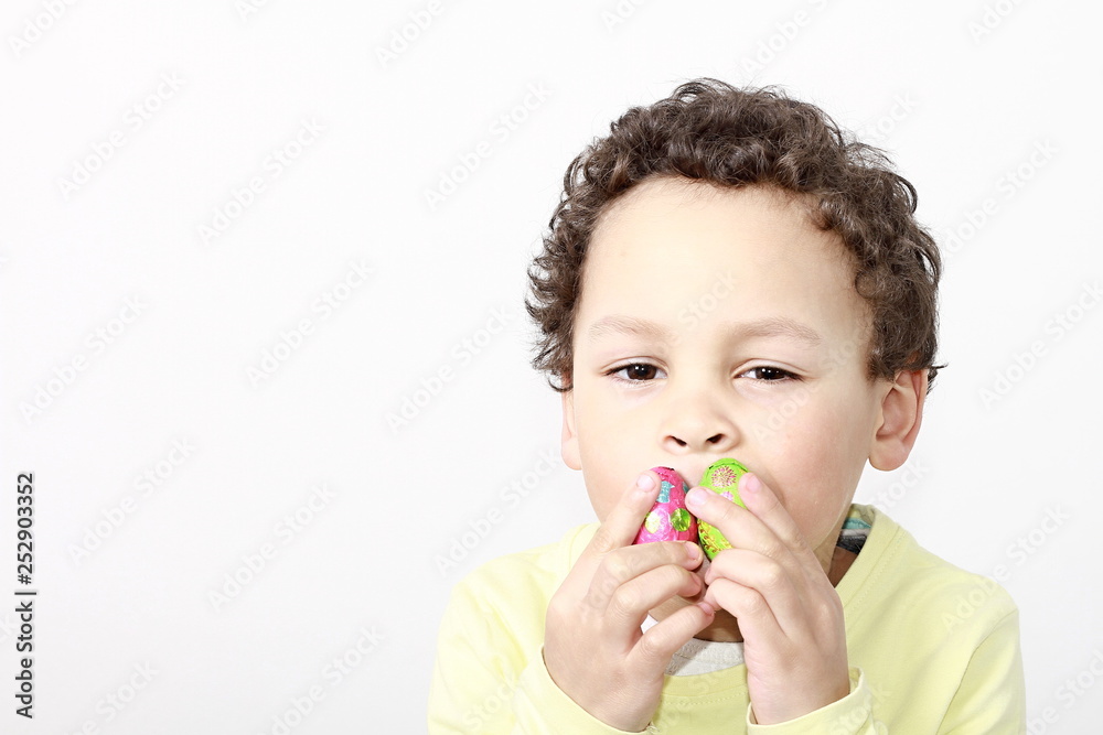 little boy with sweet chocolate Easter eggs little boy with sweet chocolate Easter eggs