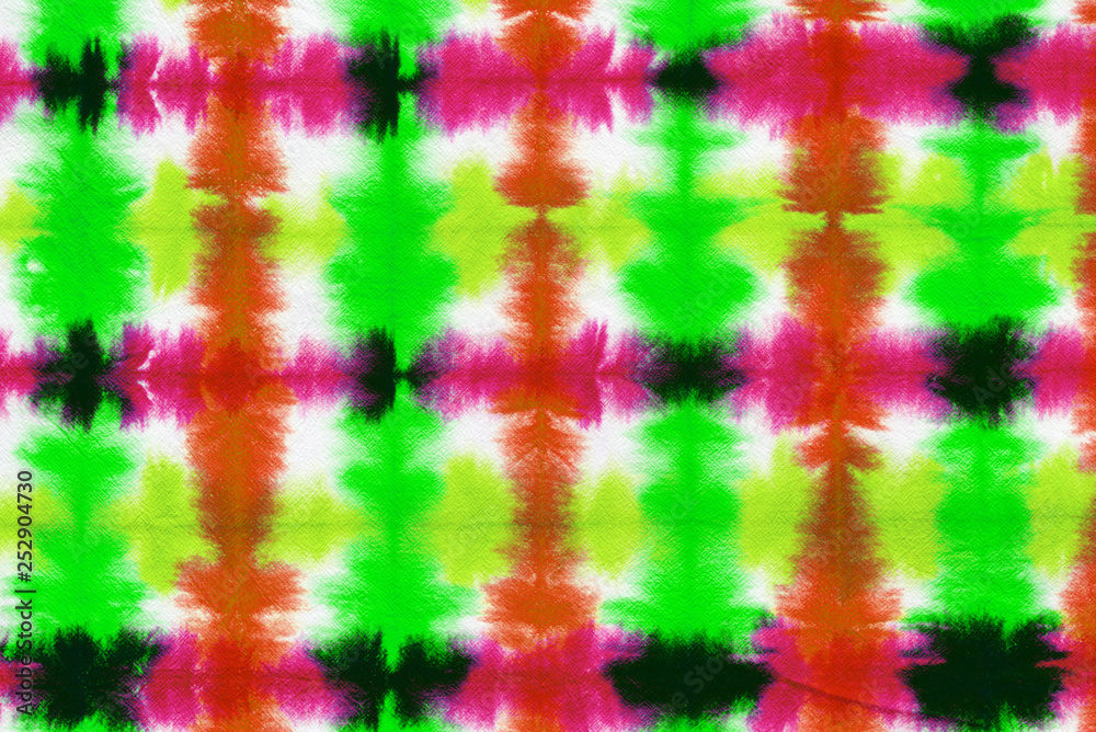 striped tie dye pattern hand dyed on cotton fabric abstract background.