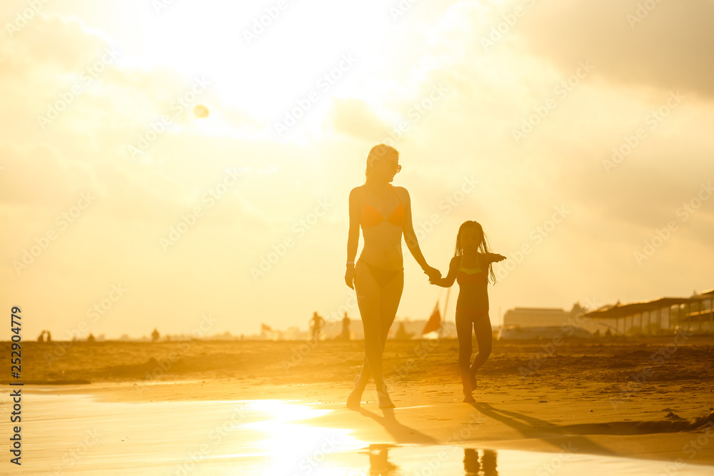 Fototapeta premium mother and daughter happy in love at sunset