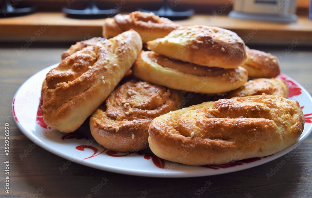 Fresh salt cake with cheese and garlic on a wooden table Fresh salt cake with cheese and garlic on a wooden table