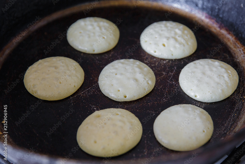 Making pancakes on frying pan top view Making pancakes on frying pan top view