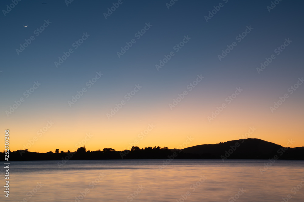 Sunrise over calm bay