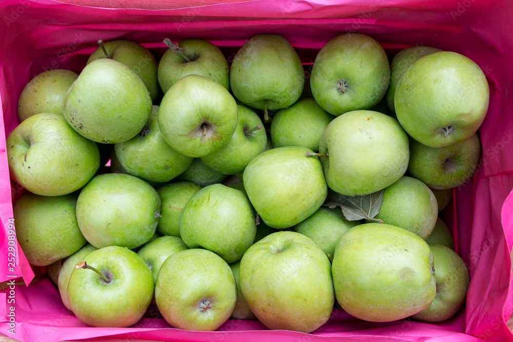 green apples in a wooden box green apples in a wooden box