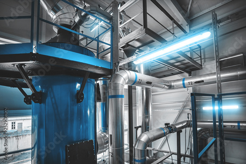 condensing economizer with fuel supply system pipes for solid-state chip boiler. Blue toning
