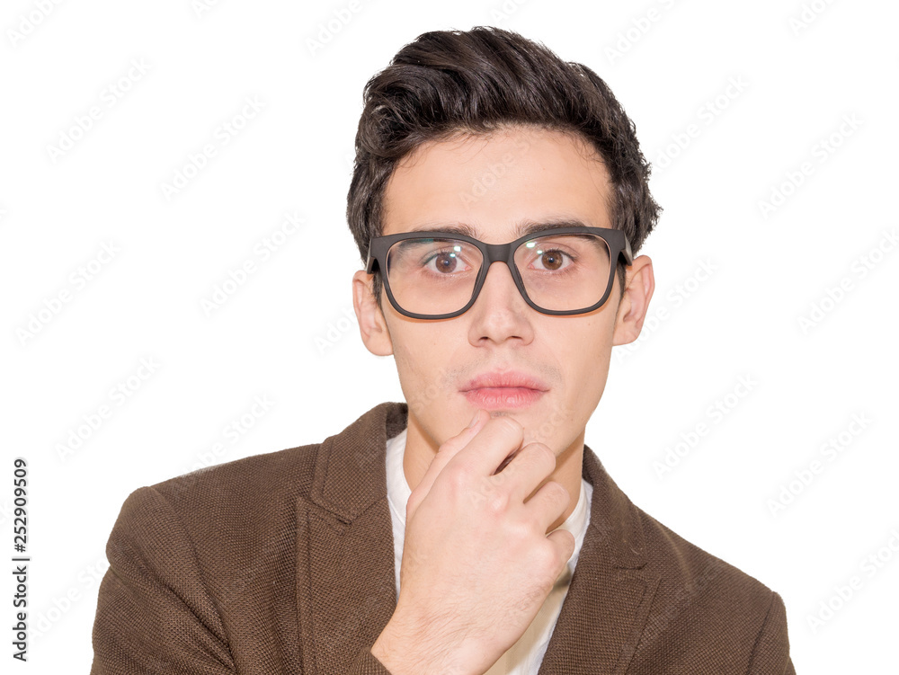 Portrait of beautiful young man wearing glasses, smiling and touching his chin Portrait of beautiful young man wearing glasses, smiling and touching his chin