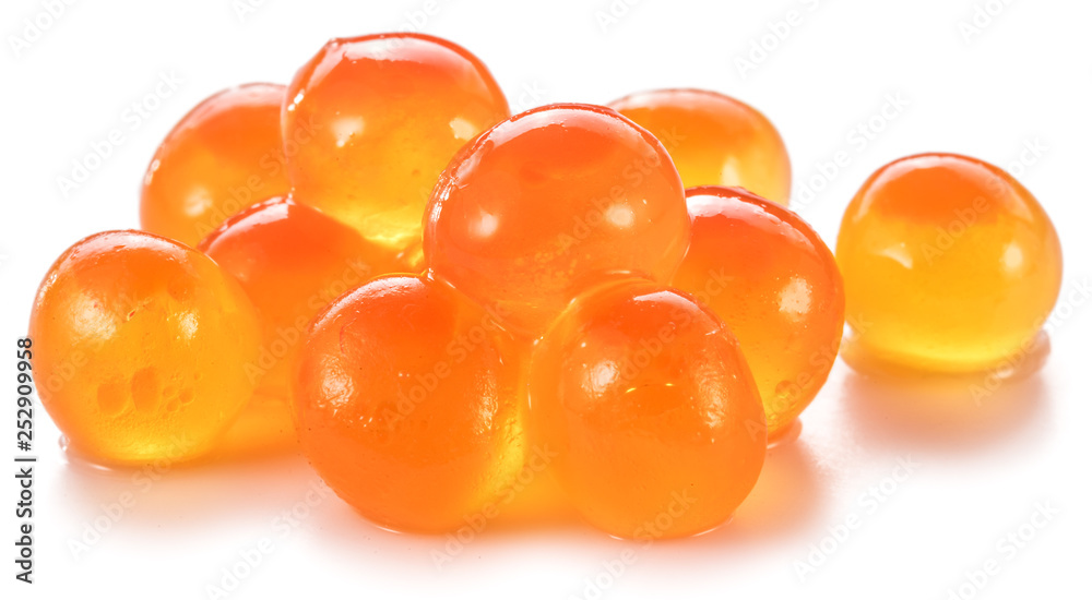 Several salmon roes on white background. Macro picture. Several salmon roes on white background. Macro picture.