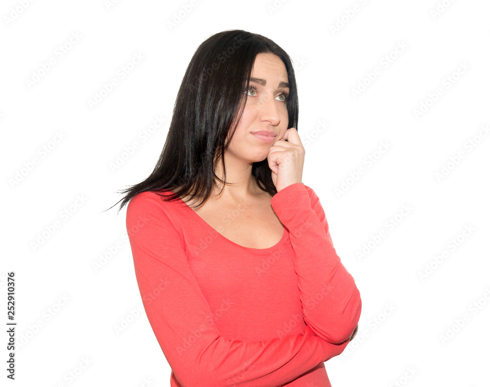 Portrait of girl touching chin while thinking and looking with s Portrait of girl touching chin while thinking and looking with s