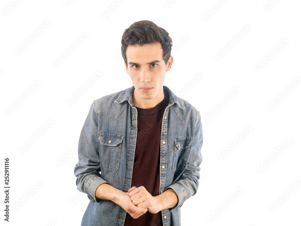 Obraz premium Portrait of young guy which dressed casually isolated on white background and looking at camera