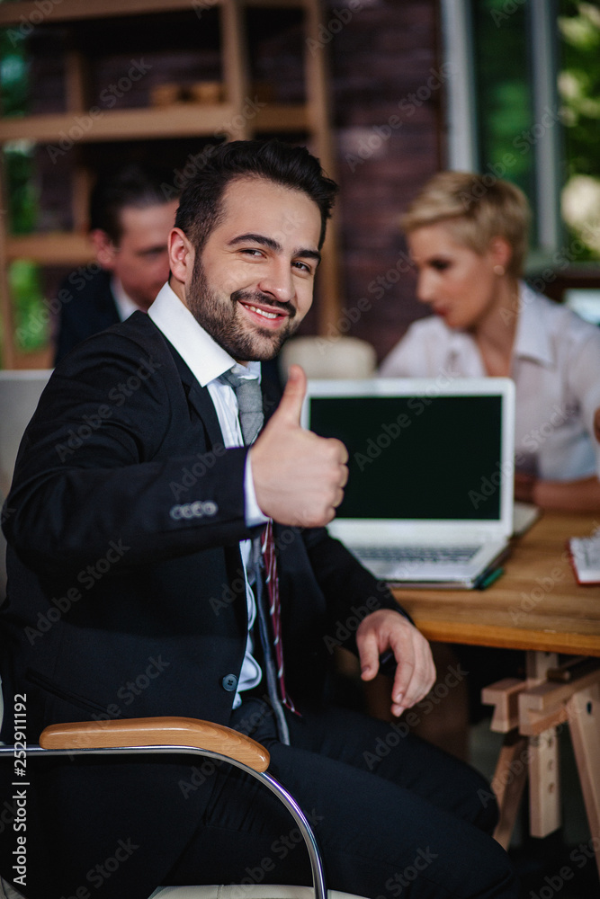 Fototapeta premium Male Office Worker Showing Thumb Up in Office