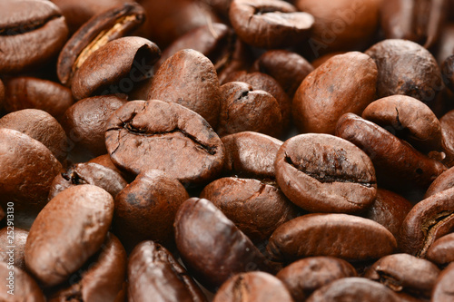 Coffee beans background. Roasted coffee beans macro close up