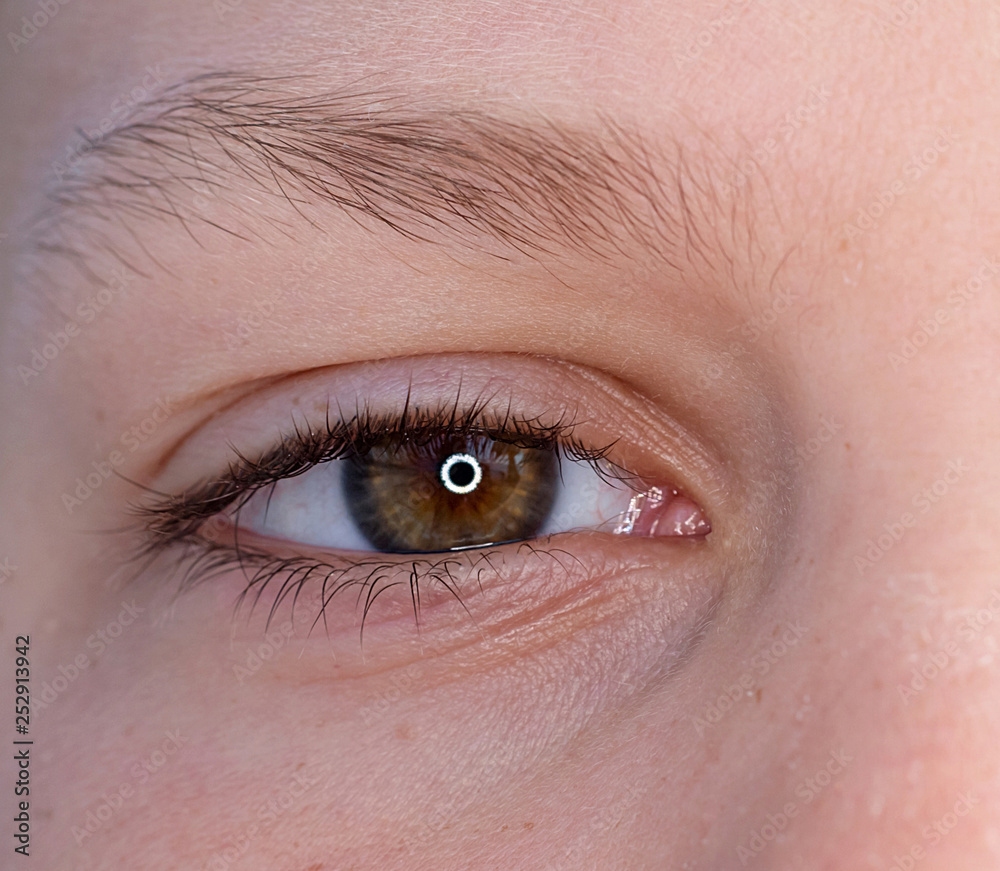 Obraz premium One eye of a teenager macro close-up