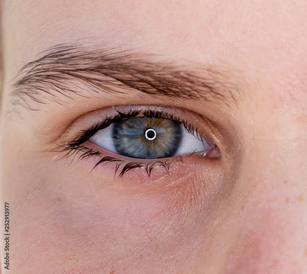 One eye of a teenager macro close-up One eye of a teenager macro close-up