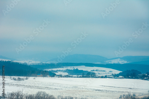 Beautiful landscape of the Ukrainian mountain village during fog