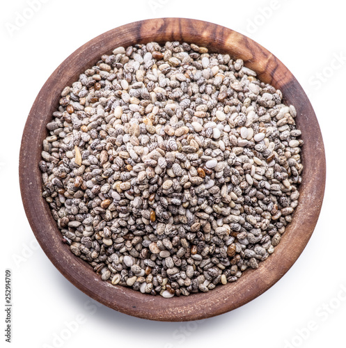 Chia seeds in wooden bowl isolated on white background. File contains clipping path.