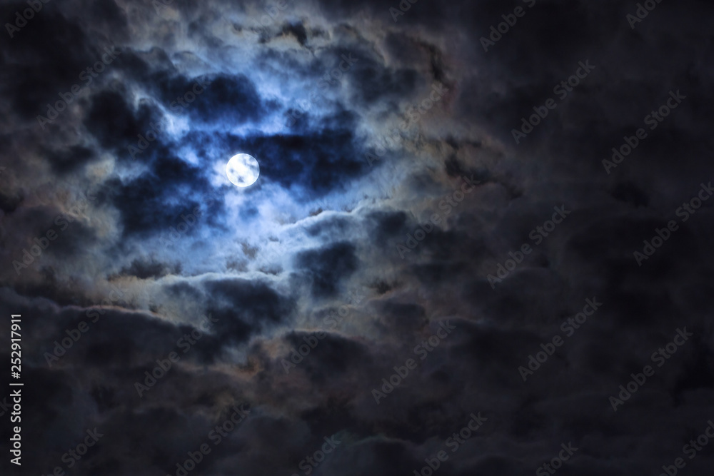 Full moon shining on the sky in cloudy evening Full moon shining on the sky in cloudy evening