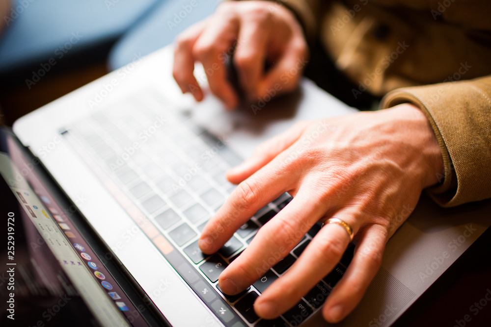 White hands typing on laptop close-up White hands typing on laptop close-up