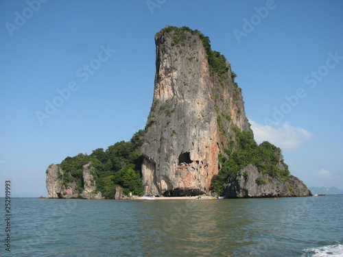 An island in the Andaman Sea. View of the island from the sea on a sunny day