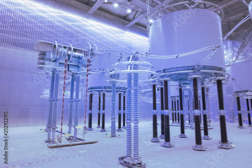 Inside high voltage direct current HVDC station. Electrical equipment in the closed substation looks futuristic.