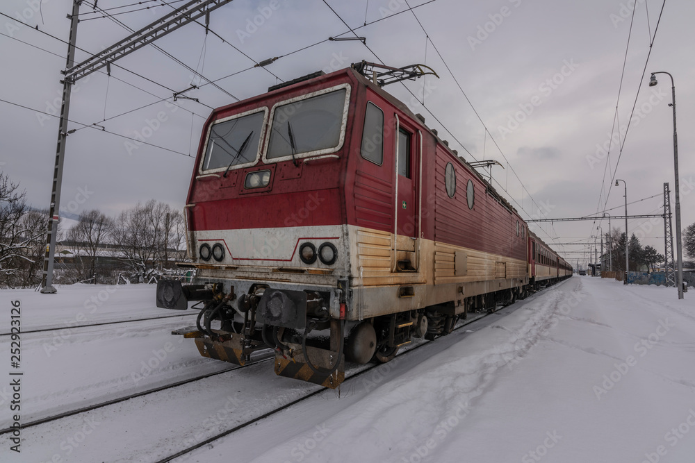 Obraz premium Lipany station in winter snow morning with trains and platforms