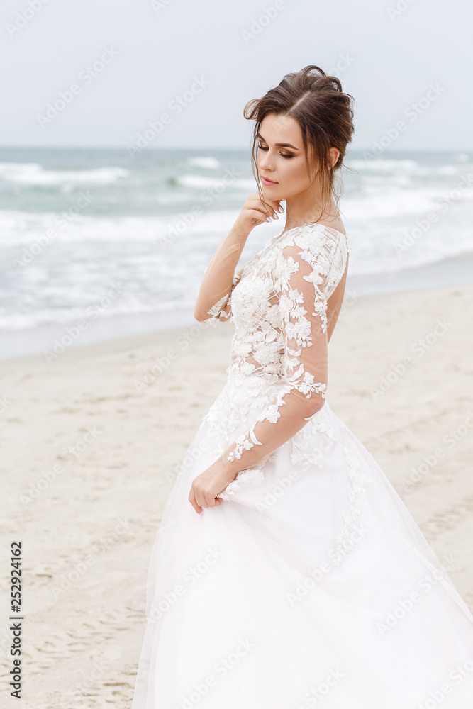 portrait of the bride on the background of the sea in windy weather portrait of the bride on the background of the sea in windy weather