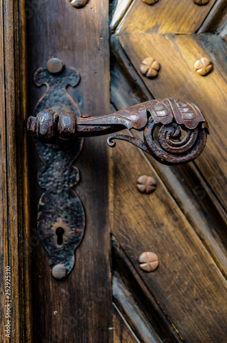 Antique iron forged door handle from the front door.
