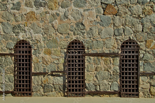 Three Iron doors and fieldstone boulder wall.  Yuma Territorial Prison operated from 1876 to 1909,  Yuma, Arizona 