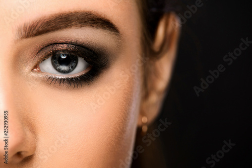 Blue left eye of the girl close up. Macro shot of an eye.