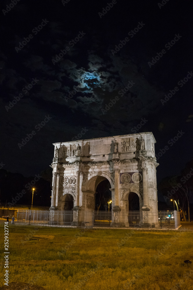 arch of constantine of the roman forum viewed at night near the colosseum in rome, Italy.