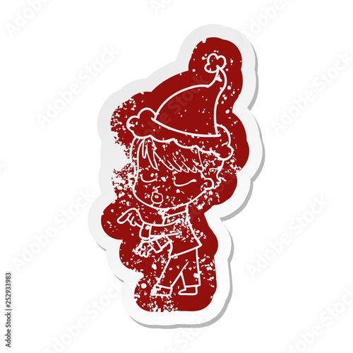 cartoon distressed sticker of a woman with eyes shut wearing santa hat