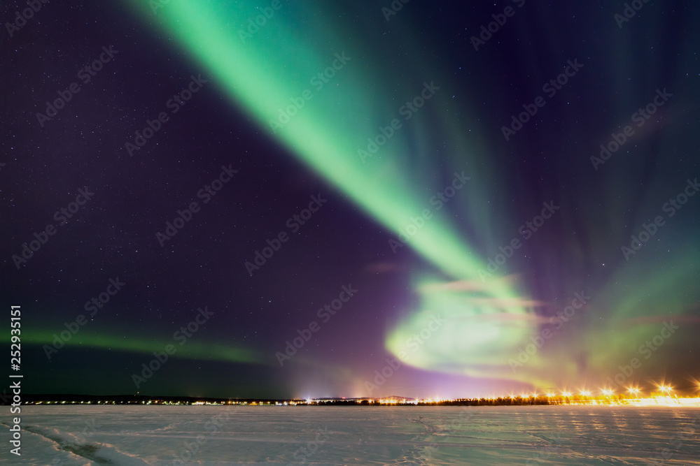 Breathtaking aurora borealis (Northern Lights) in Lapland. The polar Circle, Rovaniemi, Finland.