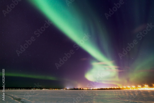 Breathtaking aurora borealis  Northern Lights  in Lapland. The polar Circle  Rovaniemi  Finland.