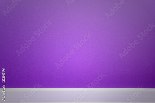 empty purple wall with white plinth and vignette