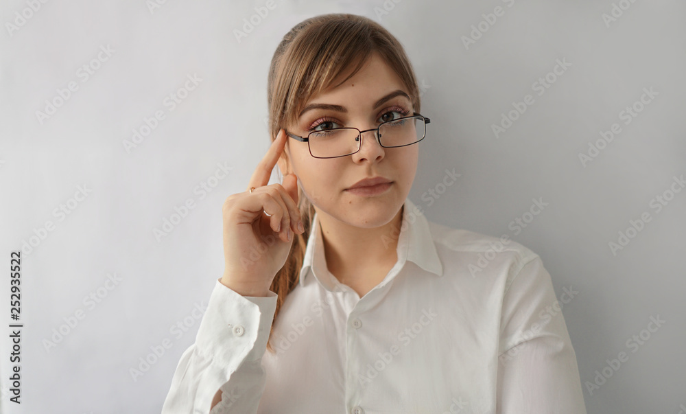 beautiful girl with glasses strict and surprised 