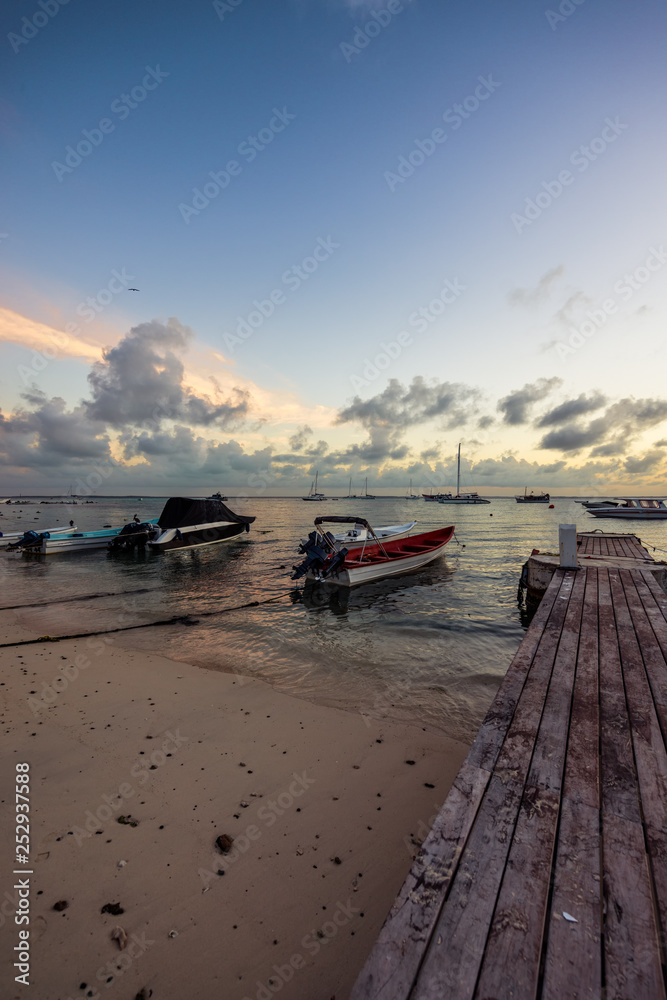 Wooden pier at sea with a beautiful sunset  at Las Aves Island, Venezuela.