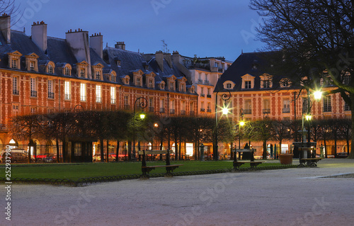 The house fronts of place des Vosges at night, Paris , France.