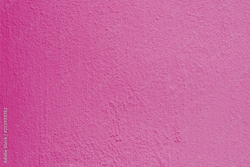 Fototapeta premium Background of a pink stucco coated and painted exterior, rough cast of cement and concrete wall texture