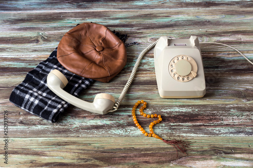 An old telephone on a wooden table