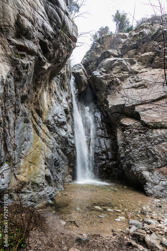 Vertical view of Millard Falls in the San Gabriel Mountains near Pasadena, Altadena and Los Angeles in Southern California.   photo